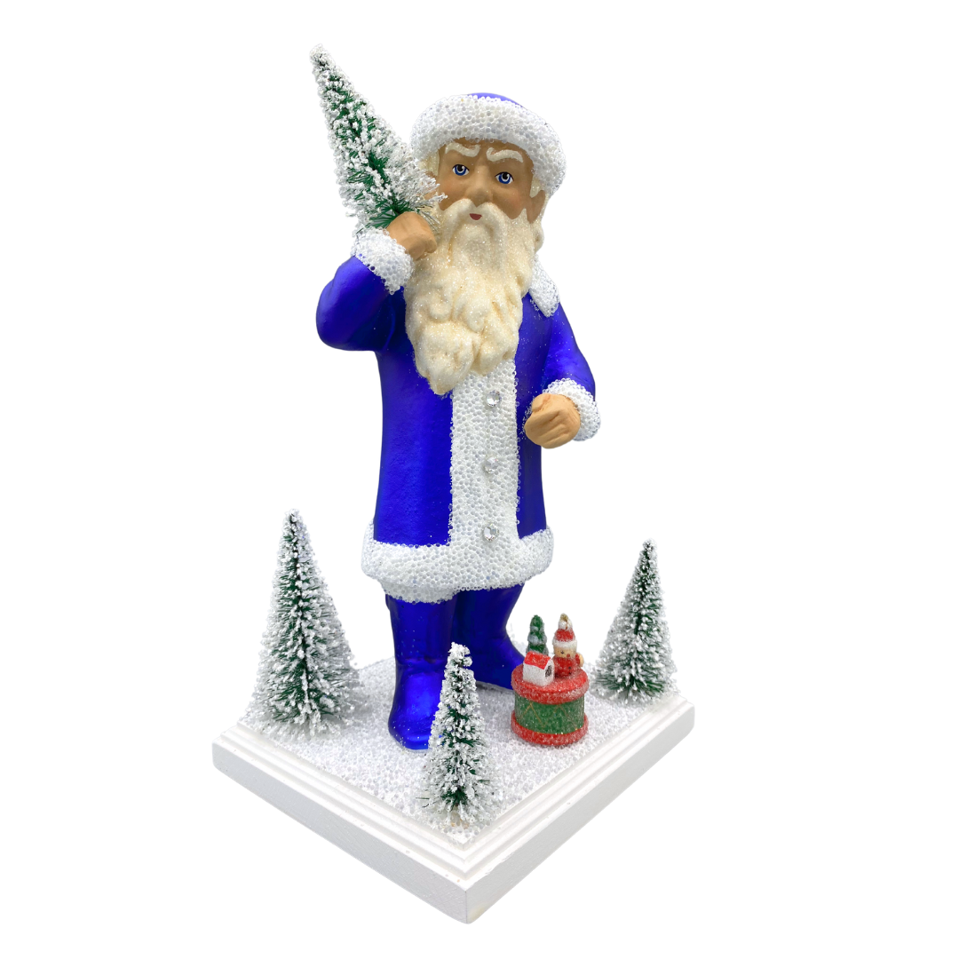 Santa with Bottle Brush Trees, Papier Mache Figure on Wood Basee, royal blue with white beaded trim by Ino Schaller