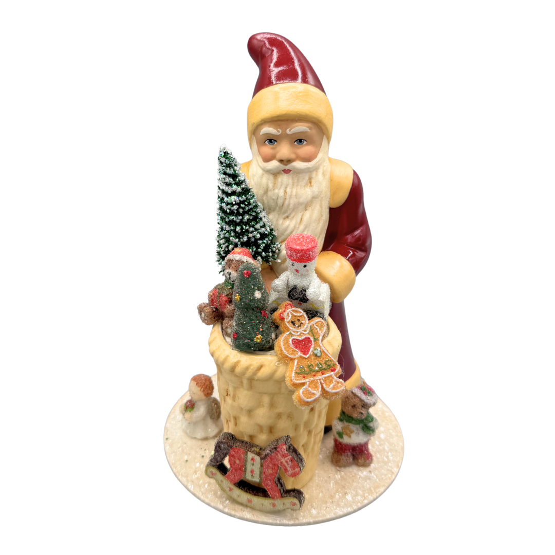 Santa Papier Mache Figure with basket of toys, old red by Ino Schaller