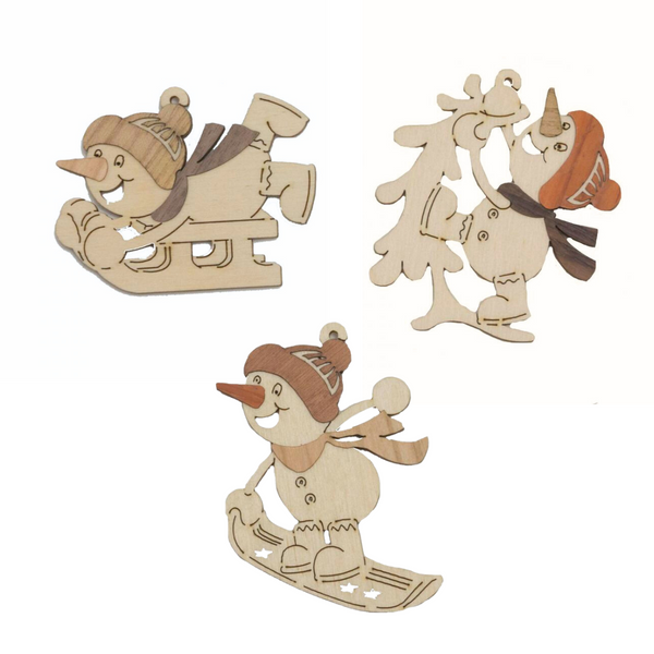 Wood Ornaments-Snowmen sledding by Kuhnert GmbH