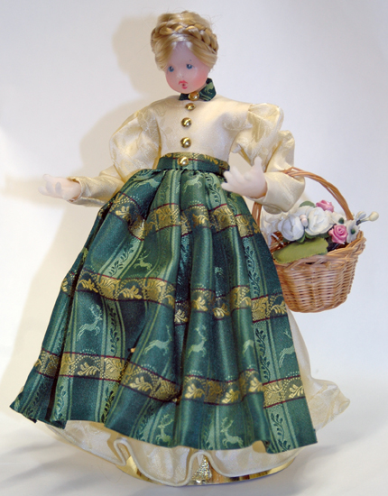 Wax Girl in Ivory Dress with Green Pinafore by Margarete & Leonore Leidel in Iffeldorf