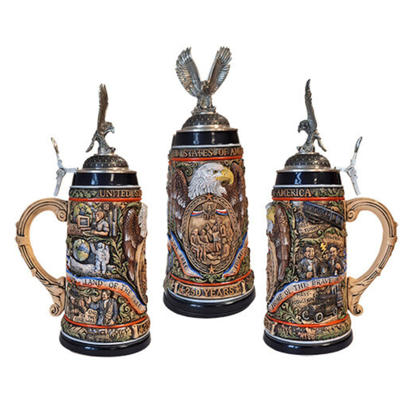 Three decorative beer steins with intricate designs and eagle embellishments on a white background.