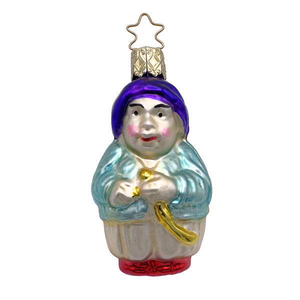 A colorful glass ornament depicting a stylized pirate character with a green coat, purple sash, and gold accents, produced by Inge Glas of Germany.