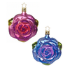 Two rose ornaments with glitter, one in blue and the other in a dusty mauve hanging from gold-colored stars, against a white background.