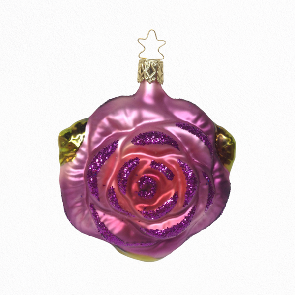 Decorative glass ornament shaped like a rose with a pink and purple gradient on a white background.