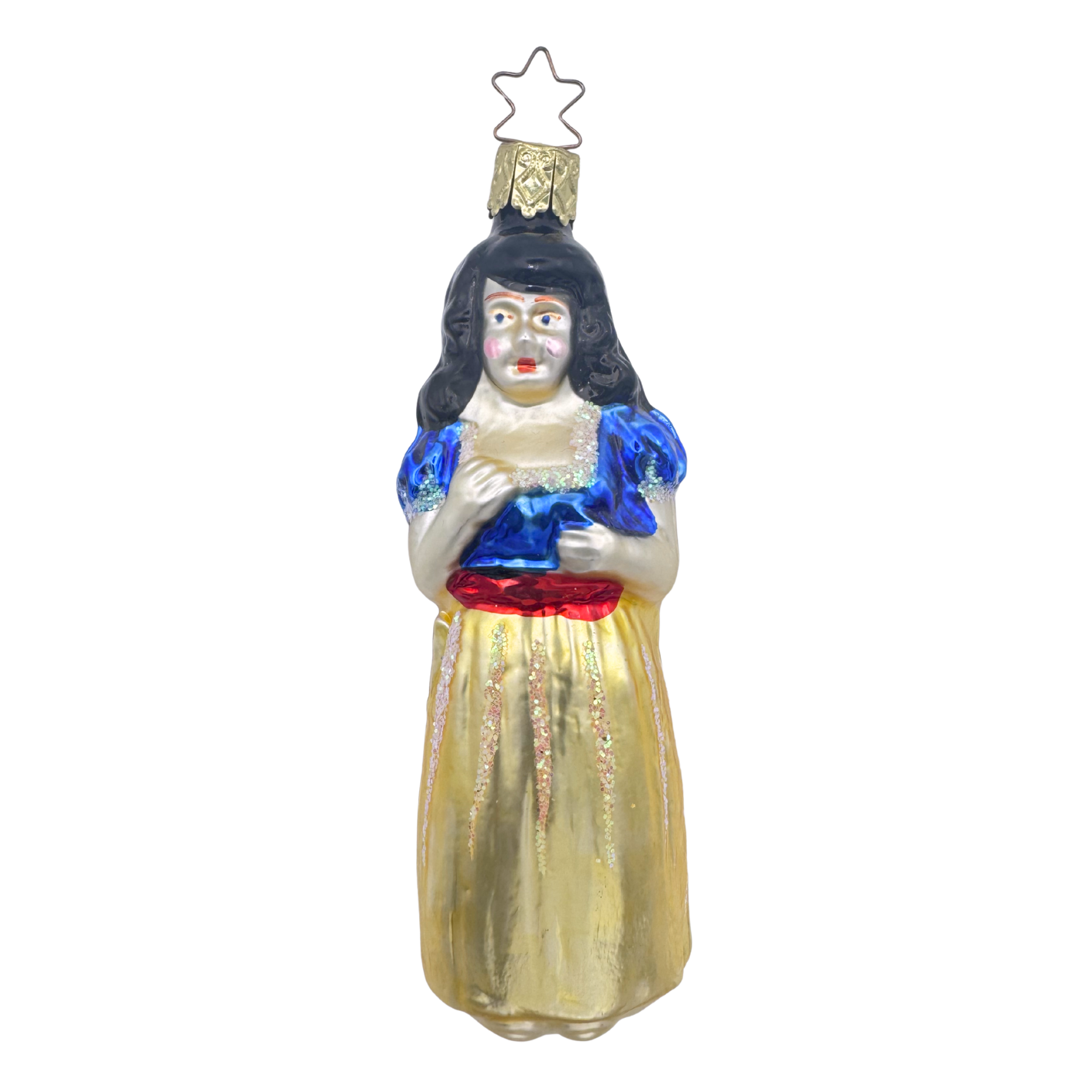 A glass ornament featuring a fairy tale princess with black hair, yellow dress with red sash and blue bodice, with a star-shaped topper for hanging.