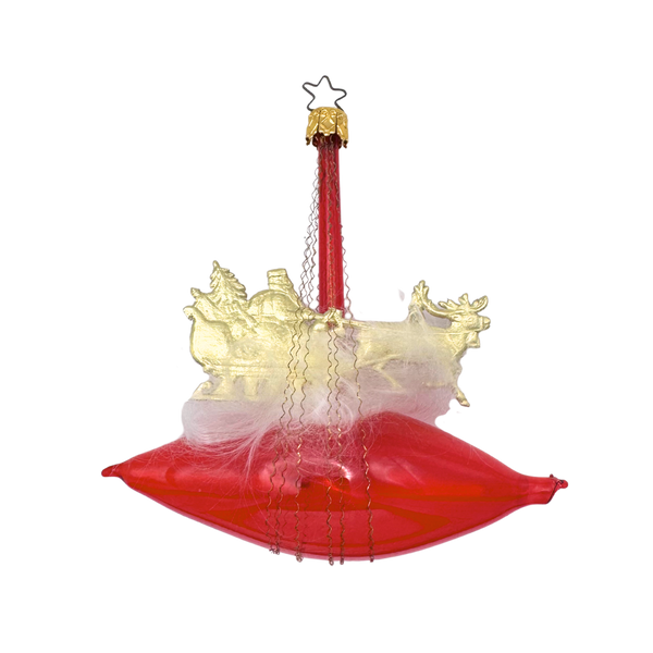 Decorative Christmas ornament with Dresden gold Santa and sleigh on red Zeppelin with Tinsel Wire with a gold star top for hanging by Inge Glas of Germany.