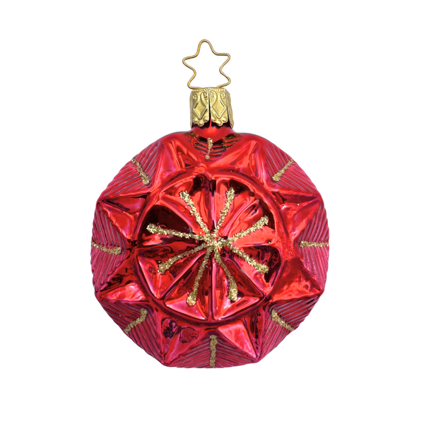 Geometric faceted red Christmas ornament with a gold star top for hanging by Inge Glas of Germany on a white background