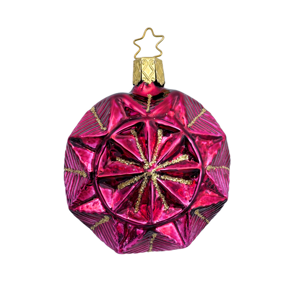 Geometric faceted burgundy Christmas ornament with a gold star top for hanging by Inge Glas of Germany on a white background