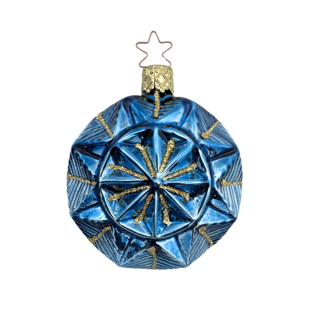 Geometric faceted teal Christmas ornament with a gold star top for hanging by Inge Glas of Germany on a white background