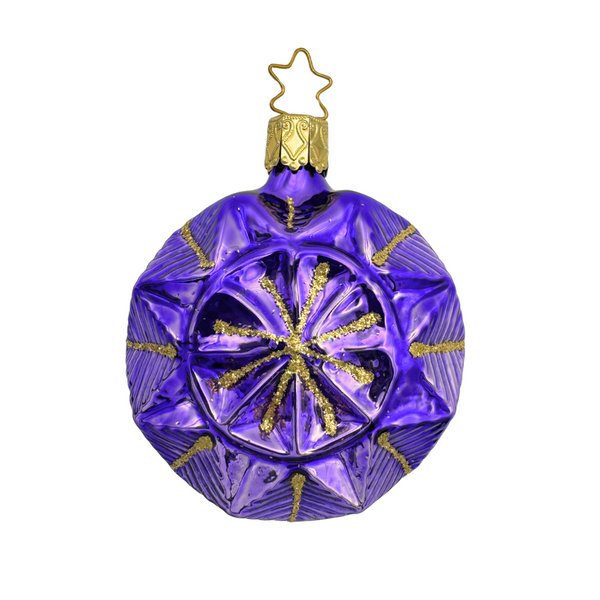 Geometric faceted purple Christmas ornament with a gold star top for hanging by Inge Glas of Germany on a white background