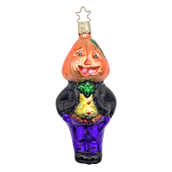 A decorative holiday ornament featuring a smiling pumpkin character in a black, purple and gold outfit.