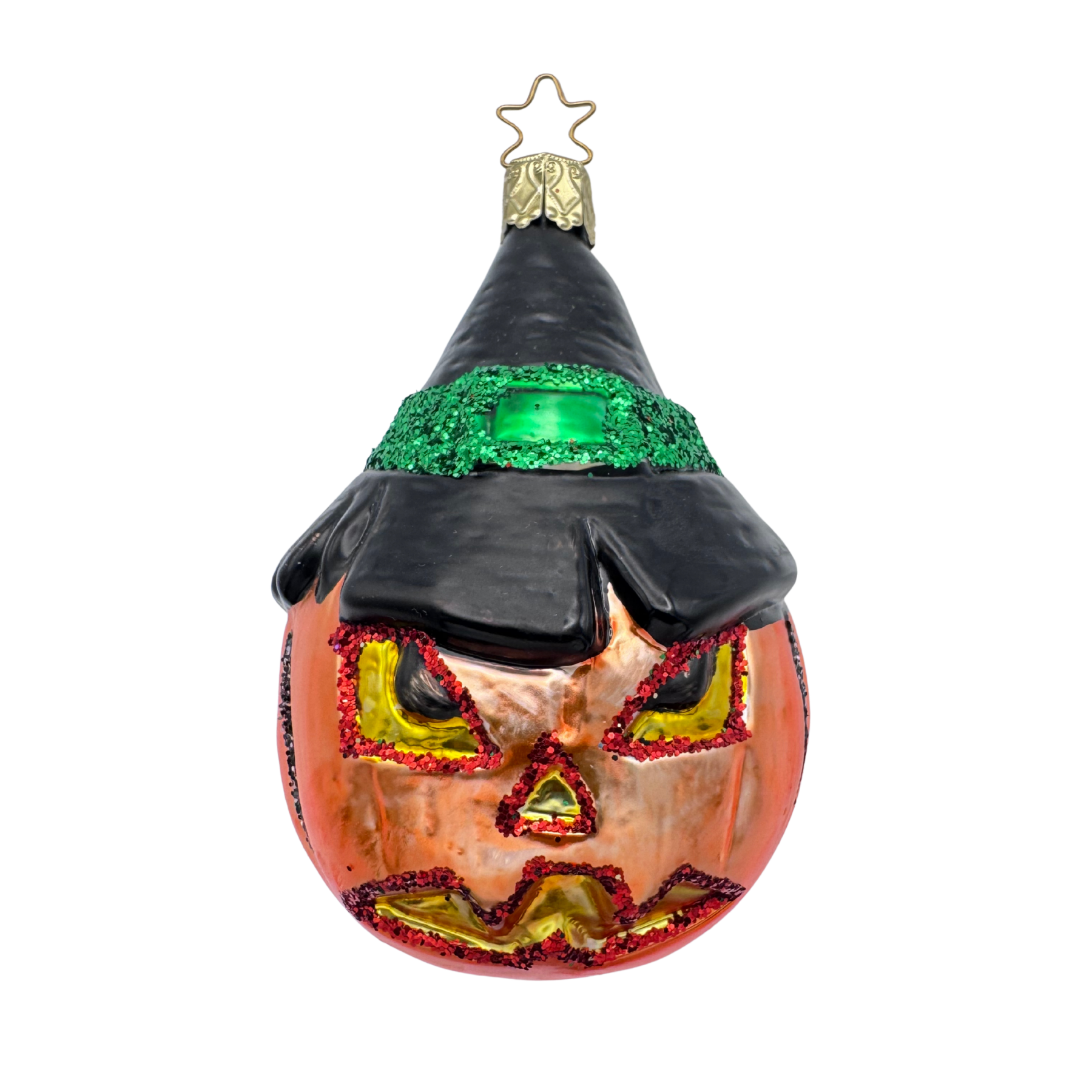 Glass pumpkin ornament with a Jack O Lantern face and witch hat on a white background. 