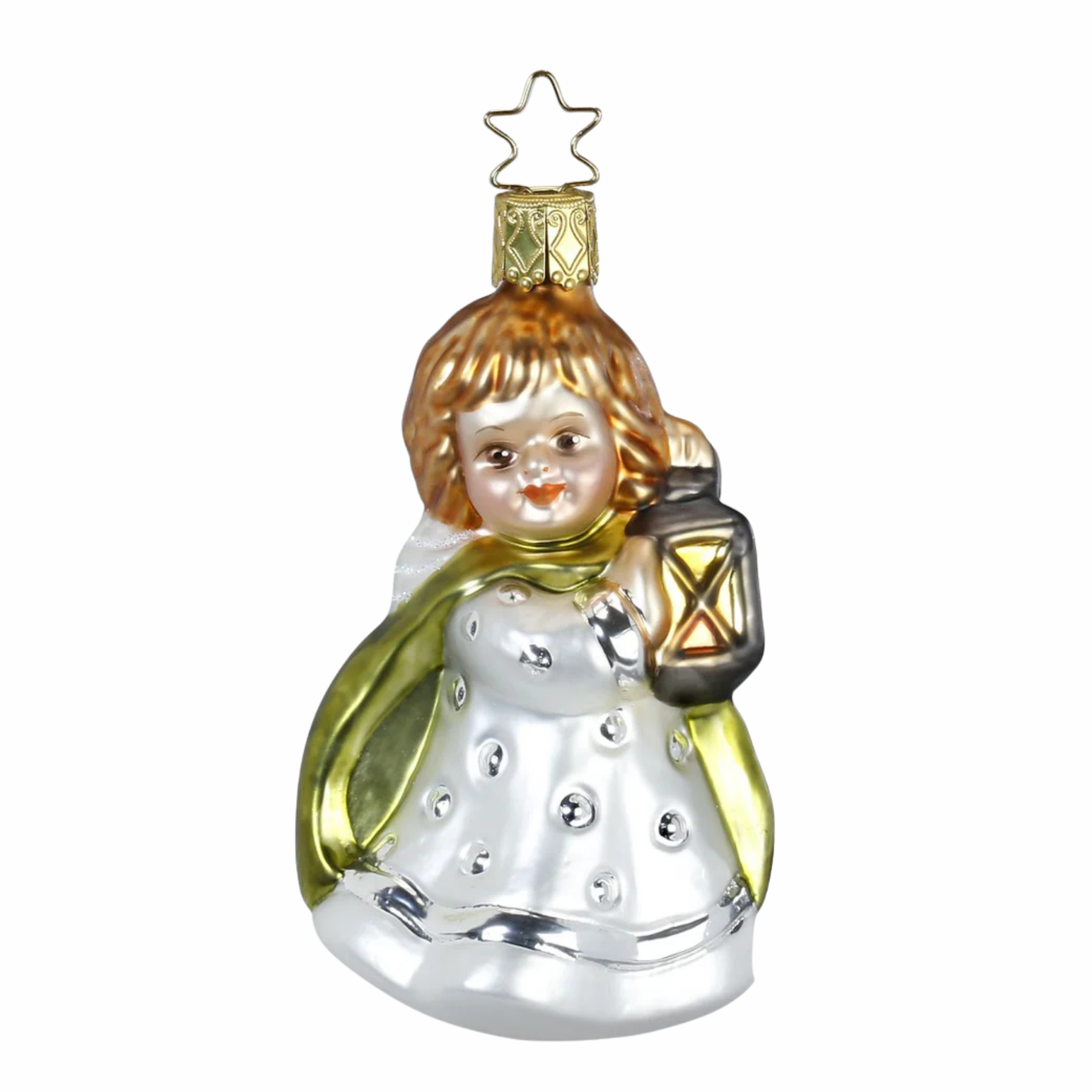 Decorative angel ornament wearing a white dress and green cape with brown hair holding a lantern on a white background