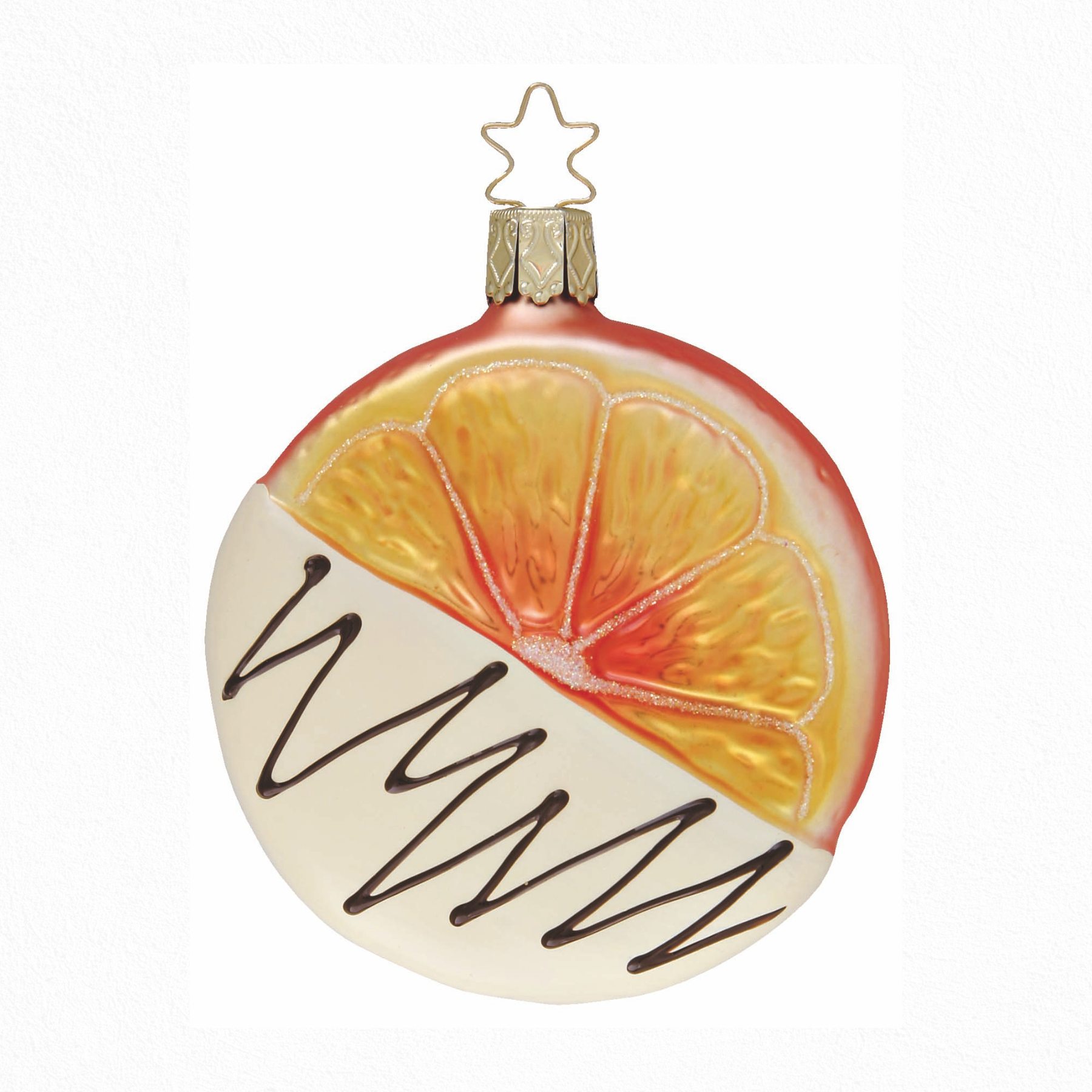 Round glass Christmas ornaments with orange slice design dipped in white chocolate with a gold star top for hanging on a white background
