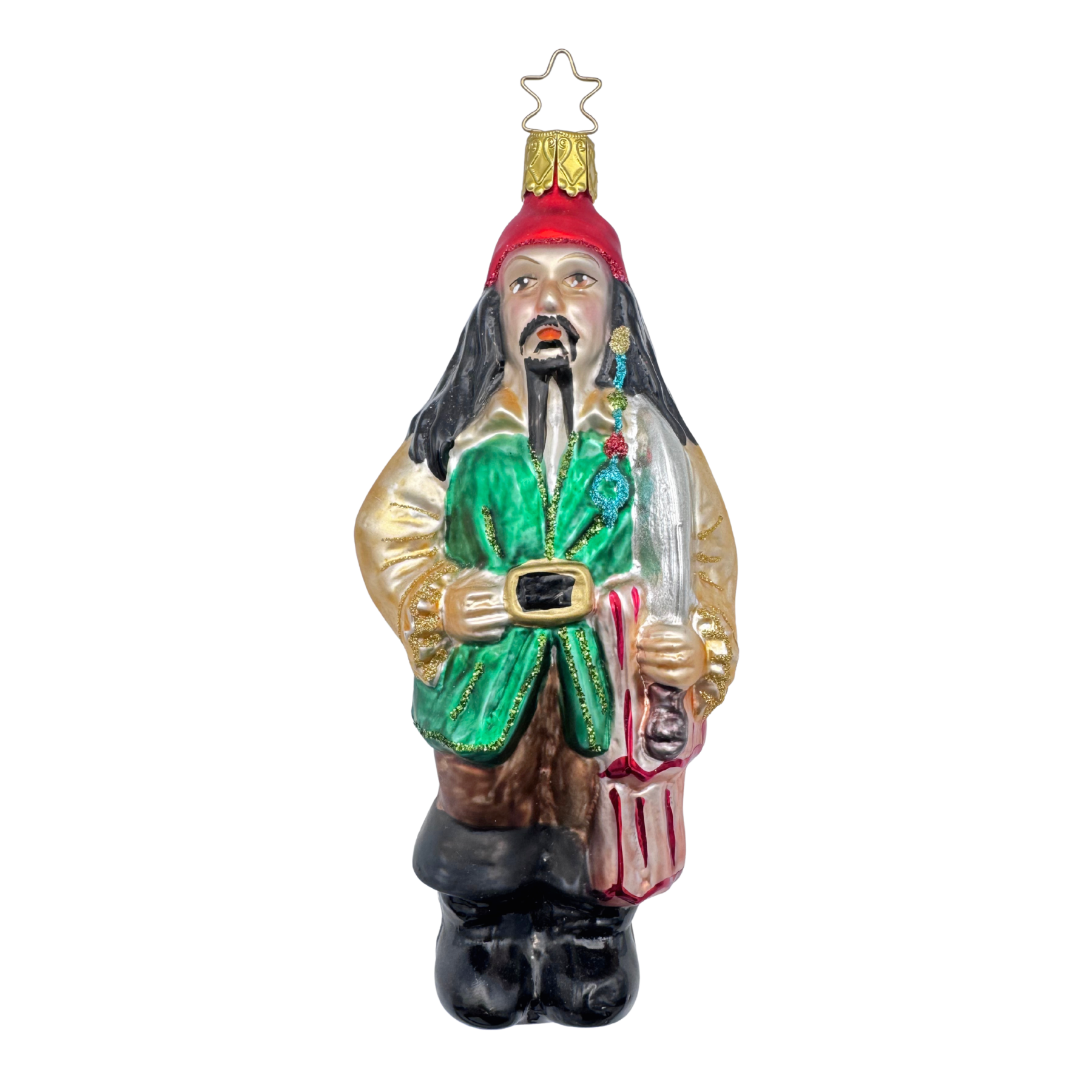 Decorative glass Christmas ornament
of a pirate dressed in gold, green and brown with a red head wrap and a gold star top for hanging by Inge Glas of Germany.