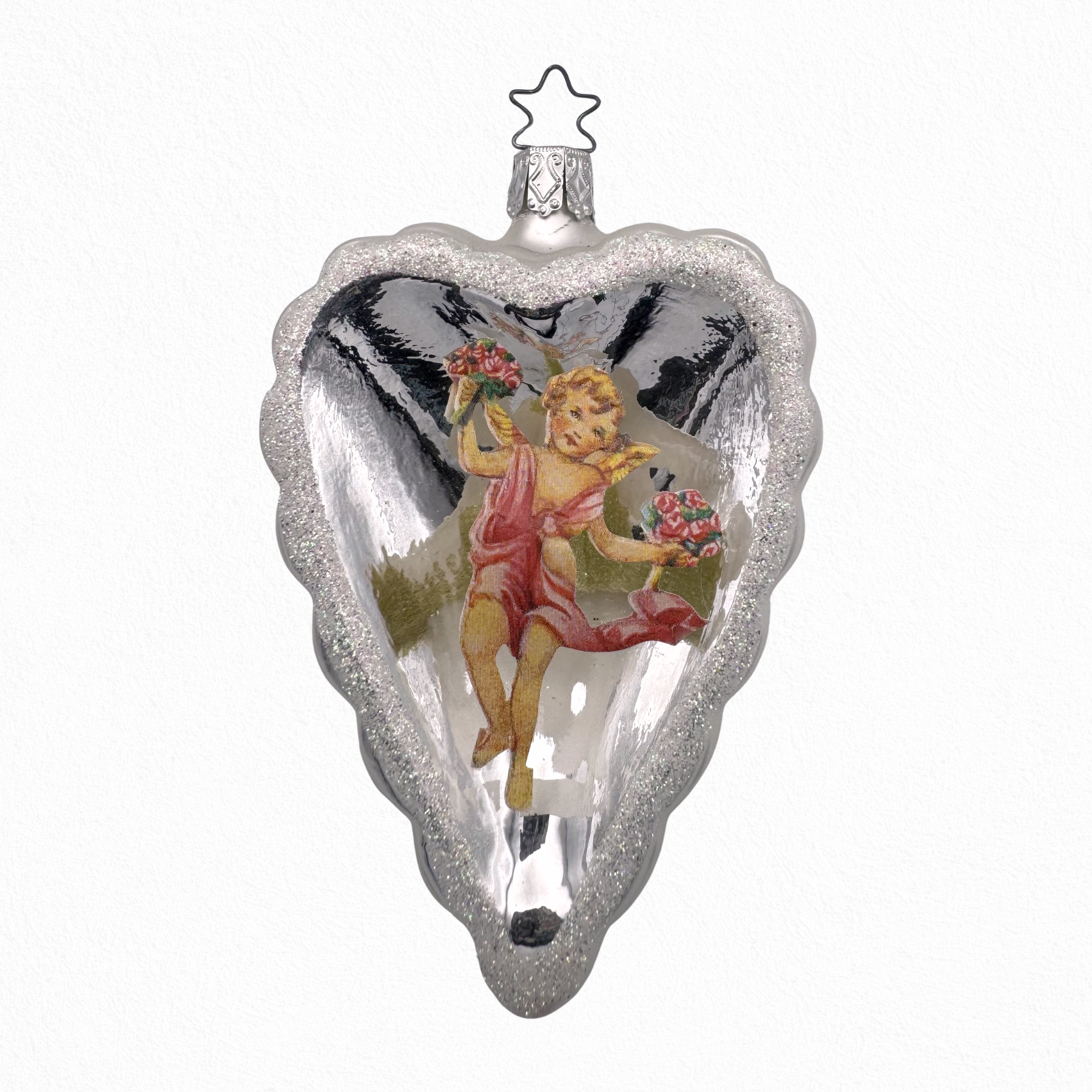 Decorative angel ornament on a heart shape, with a star-shaped topper for hanging.