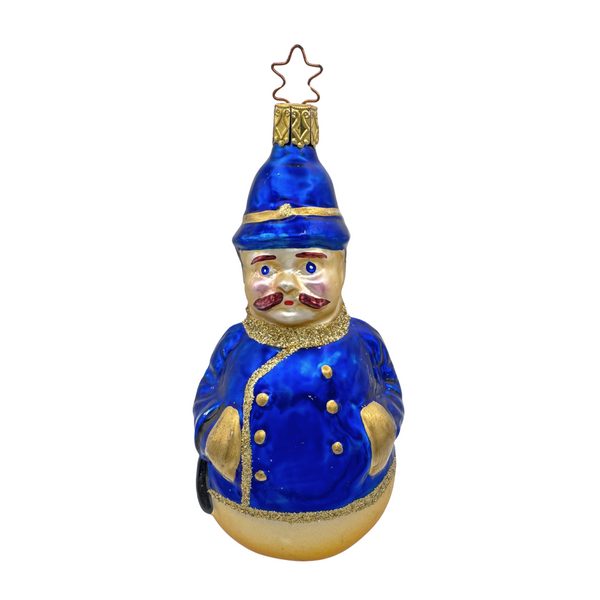 Decorative glass ornament of a blue-clad vintage police officer figure with a gold star top for hanging by Inge Glas of Germany