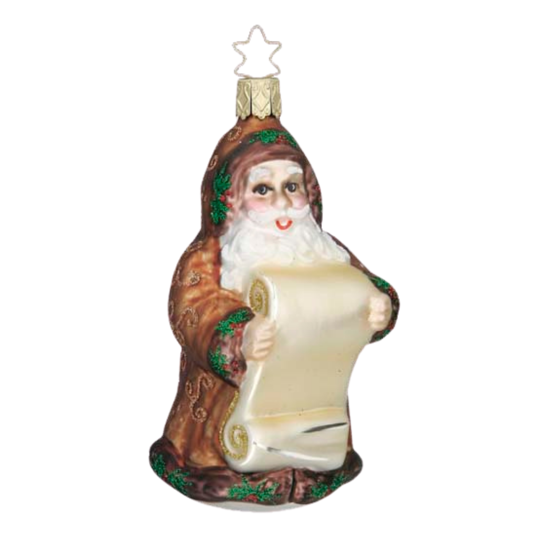 Decorative glass Christmas ornament
of Santa in a brown coat and hat, accented with holly leaves and berries. He is holding a blank scroll intended to be personalized with names. It has a gold star top for hanging by Inge Glas of Germany.