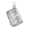 Silver gift ornament with a star topper for hanging and a swirl design and a matte finish with white bow and gem accent.