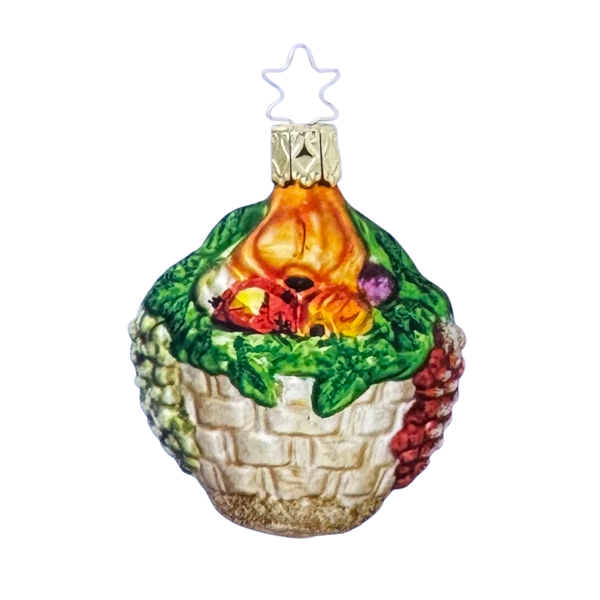 Decorative glass ornament in the shape of a basket of vegetables, with a star-shaped topper for hanging.