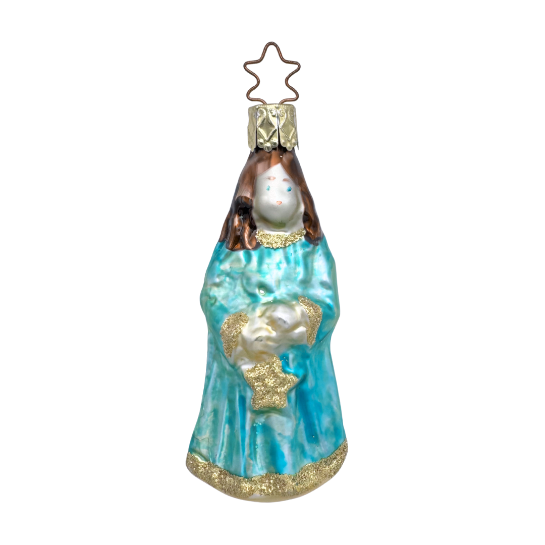 Decorative glass figure of a woman holding a child, with a star on top, on a white background. This ornament is mouth blown glass and hand painted by Inge Glas of Germany.