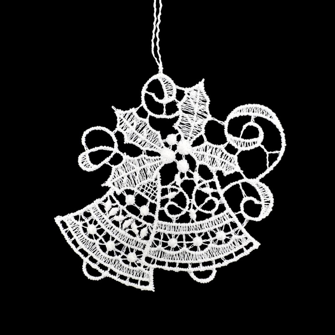 Lace double bell ornament with holly leaves and berries on a black background