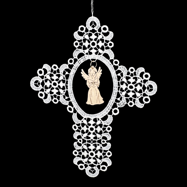 Decorative white lace cross with a scroll swirl pattern and a wood angel cut out holding a song book on a black background