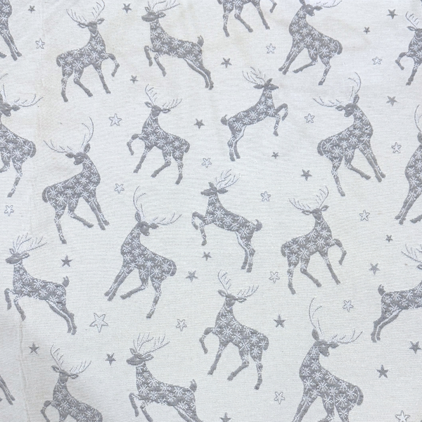 Close up pattern of stags and stars in a dark silvery gray on a light gray background
