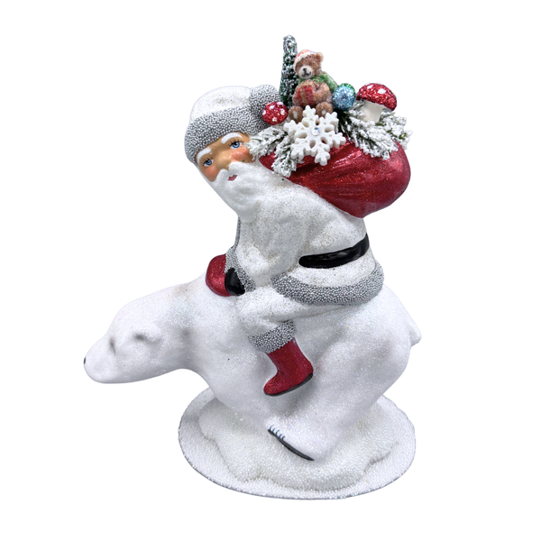 Santa on Polar Bear Papier Mache Candy Container , with red sack of toys by Ino Schaller