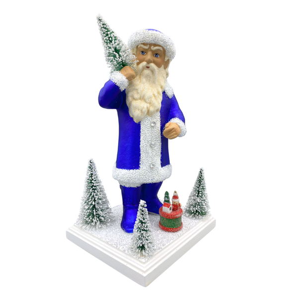 Santa with Bottle Brush Trees, Paper Mache Figure on Wood Basee, royal blue with white beaded trim, by Ino Schaller