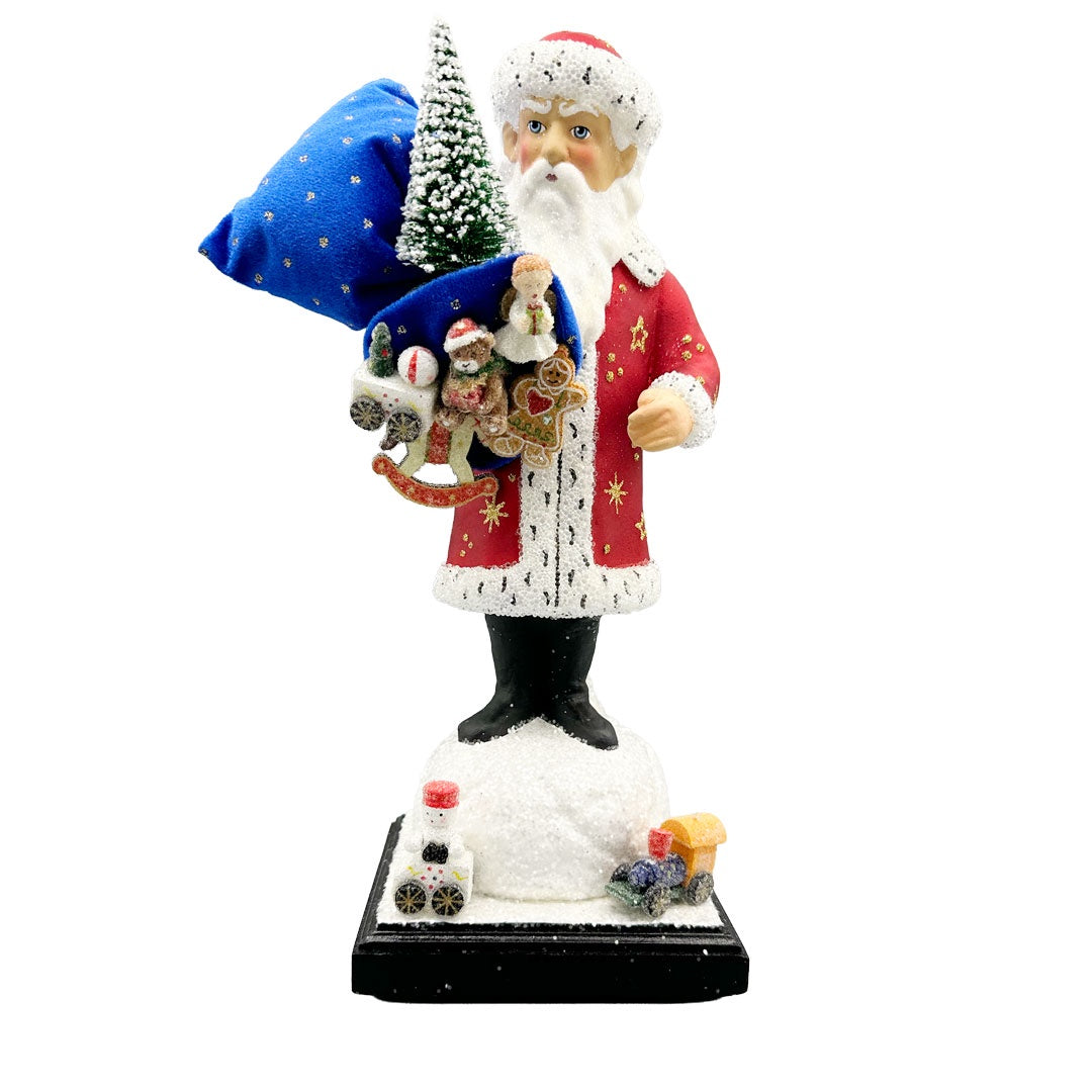 Red Coated Santa with Bag of Toys on Base by Ino Schaller