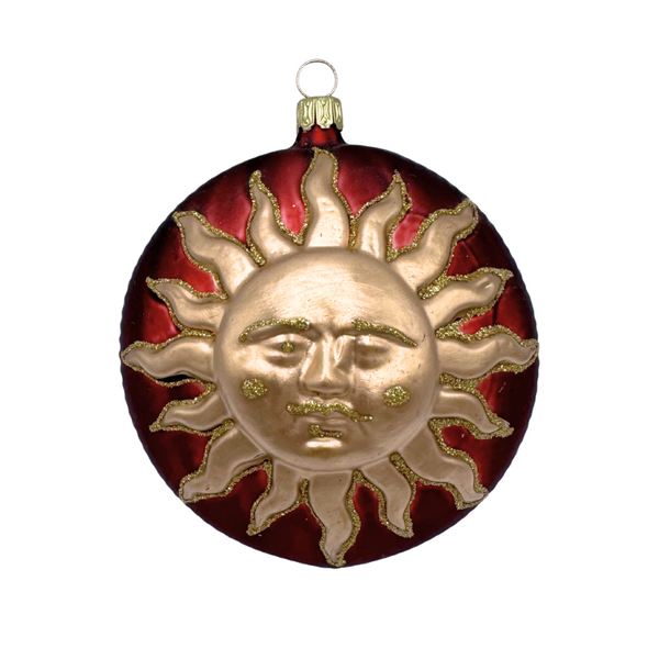 Sun, gold on dark red form by Old German Christmas