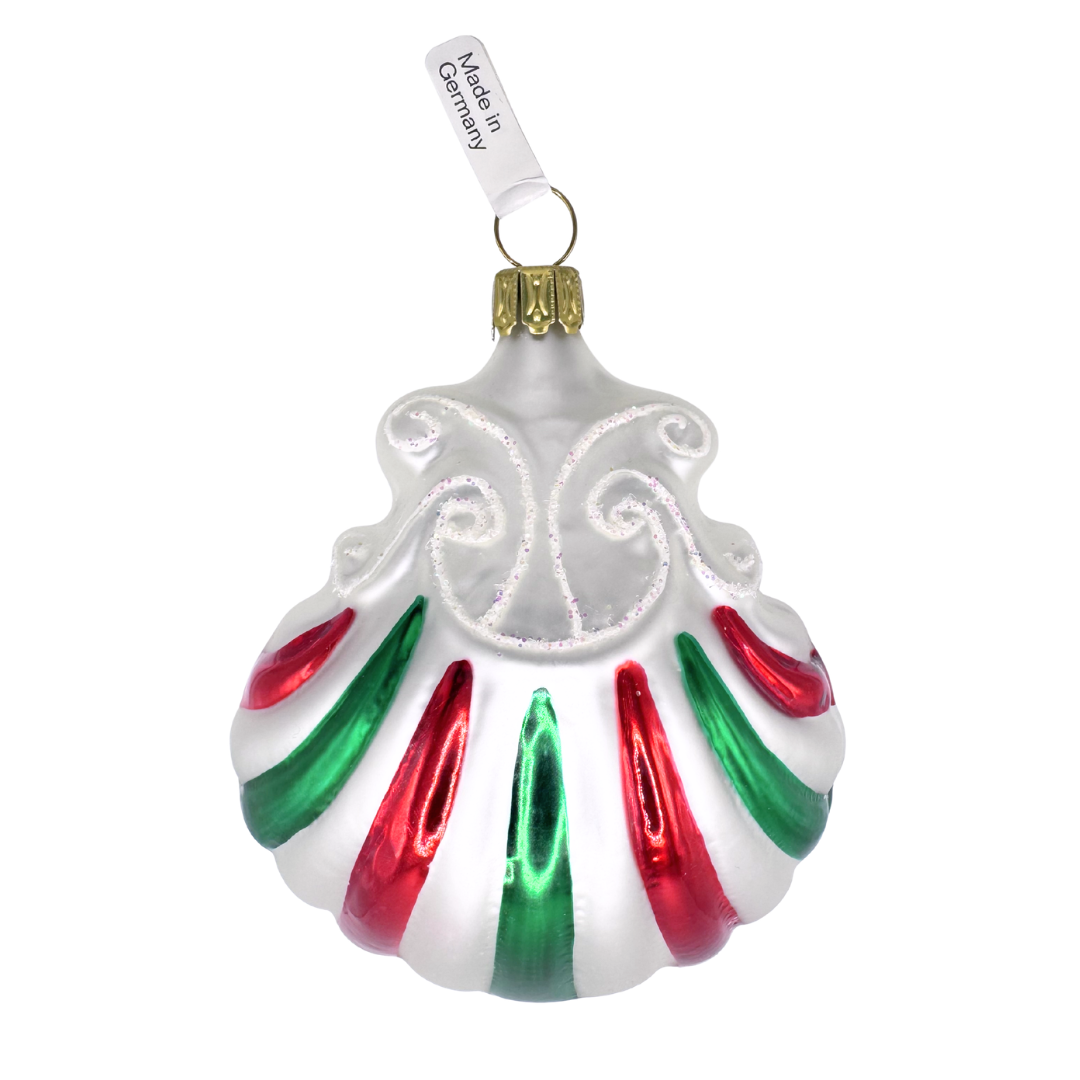 Decorative Christmas ornament in the shape of a shell with green, white and red stripe design and glitter accents on a white background