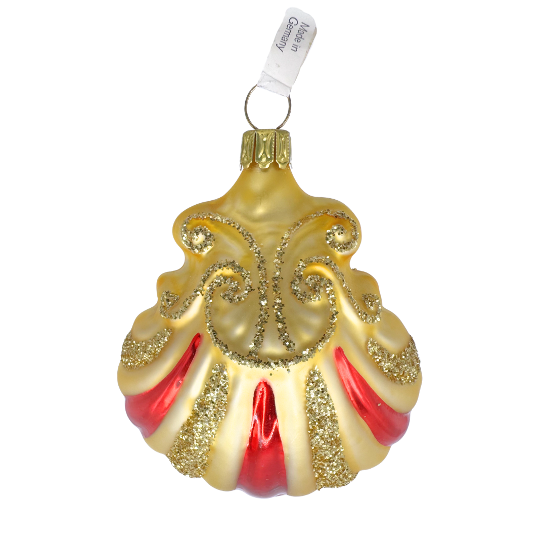 Decorative Christmas ornament in the shape of a shell with gold and red stripe design and glitter accents on a white background