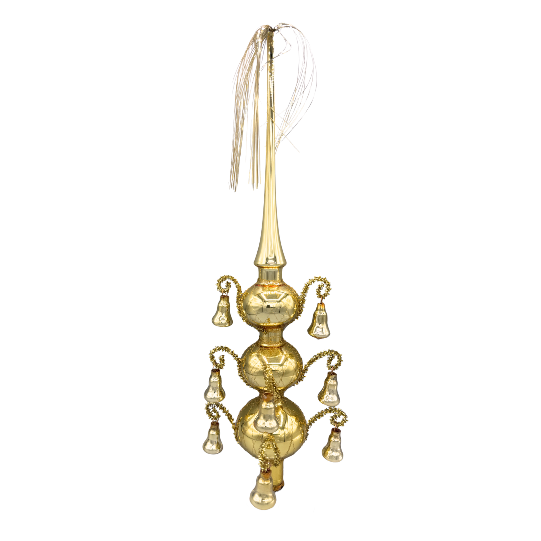 Decorative gold blown glass finial tree topper, with three tiers of bells and a tinsel tassel coming out of the pointed top.
