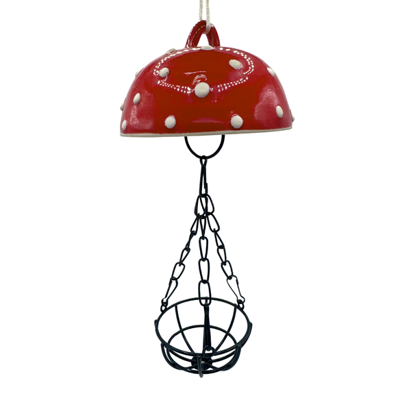 Red porcelain top with white dots and black chain on a white background