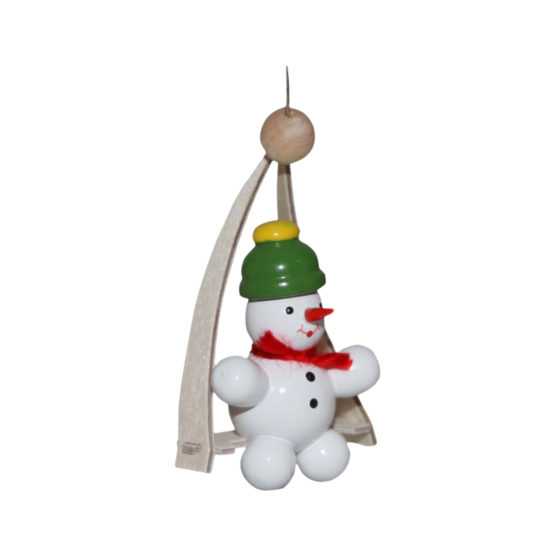 Decorative snowman on a swing ornament with a green hat and red yarn scarf on a white background