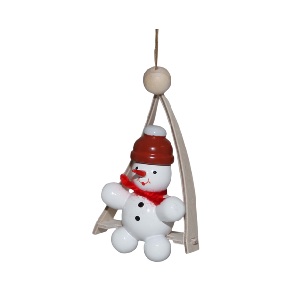 Decorative snowman on a swing ornament with a red hat and red yarn scarf on a white background