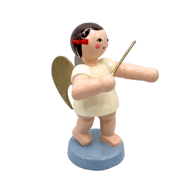 Miniature figure of a standing angel with gold wings as a conductor on a blue base