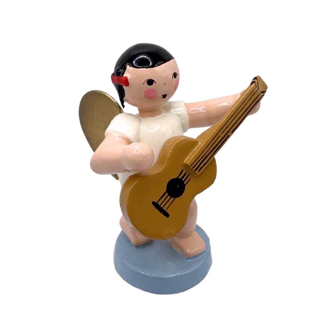 Miniature figure of an angel with gold wings playing a guitar on a blue base
