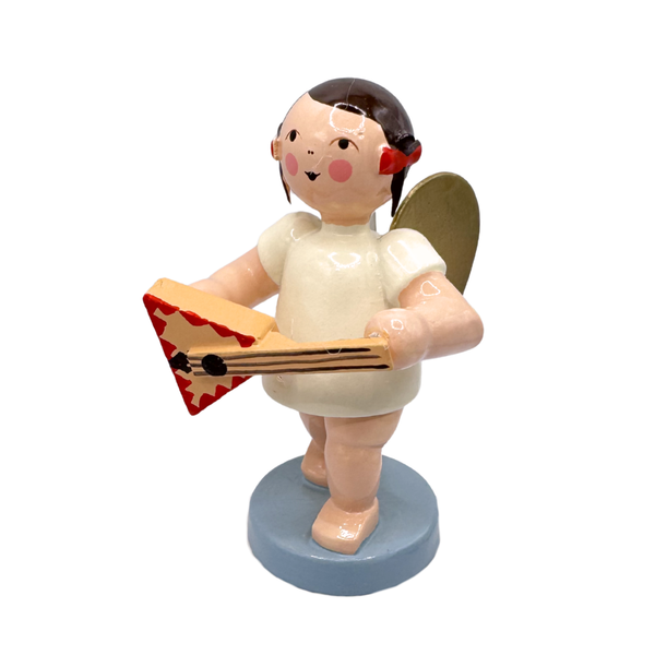 Miniature figure of a standing angel with gold wings playing a triangular guitar shaped instrument on a blue base