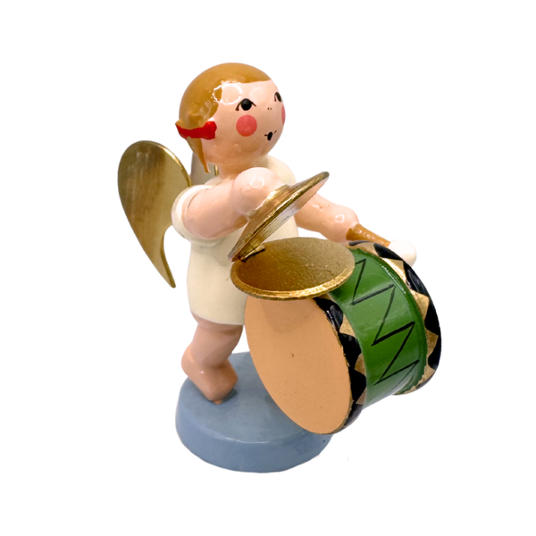 Miniature figure of a standing angel with gold wings playing a cymbal drum on a blue base
