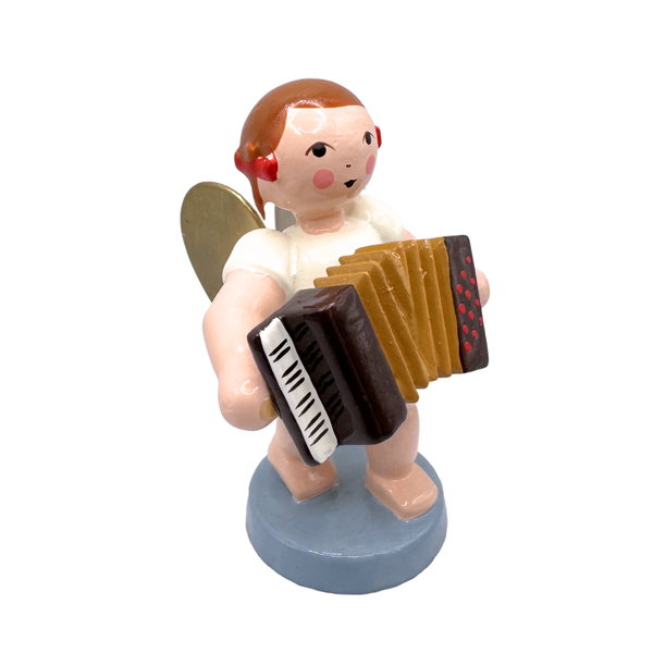 Miniature figure of a standing angel with gold wings playing an accordion on a blue base