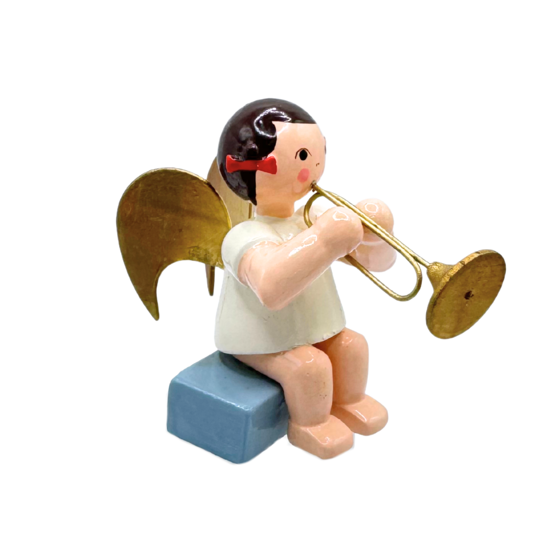 Angel with Trumpet, brunette, sitting by Ulmik