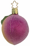A purple and pink glass plum Christmas ornament with a golden star top by Inge Glas of Germany.